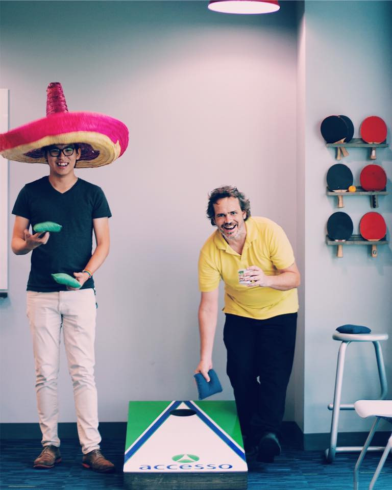 Zack and Harry Playing Cornhole at accesso